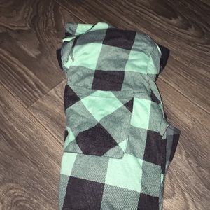 A black and green plaid long sleeve shirt